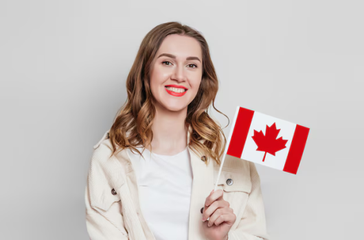 Screenshot 2024-07-12 at 22-56-18 girl-student-smiling-holding-small-canada-flag-looking-away-isolated-grey-background_101969-1193.jpg (AVIF Image 626 × 417 pixels)